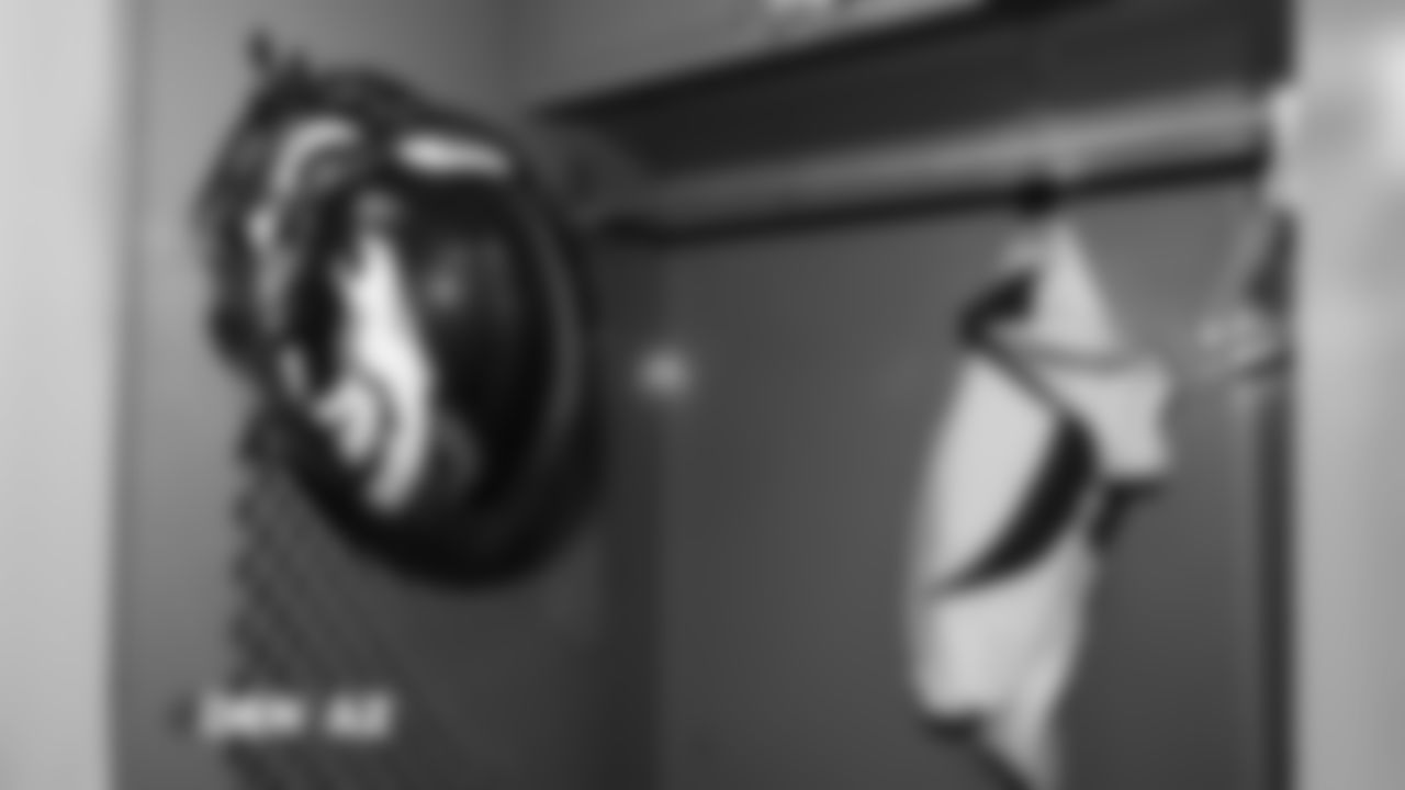 A helmet and pants in the locker room pregame before the Broncos' Week 7 game against the Arizona Cardinals at State Farm Stadium on October 18, 2018.