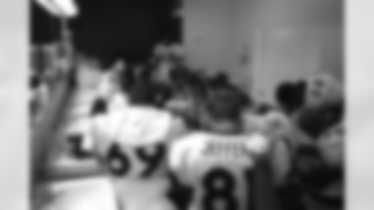 Kansas City: Patrick Jeffers and his teammates have a pre-game prayer before their game against the Chiefs against the Kansas City Chiefs at Arrowhead Stadium in Kansas City, MO on January 4, 1998.