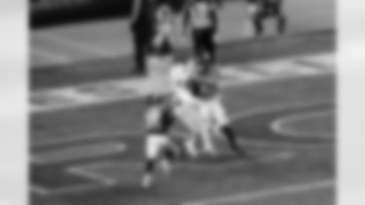 Justin Simmons intercepts a pass in the end zone to clinch victory during the Broncos' Week 11 game against the Miami Dolphins at Empower Field at Mile High in Denver, Colorado on November 22, 2020. (Photo by Ben Swanson)