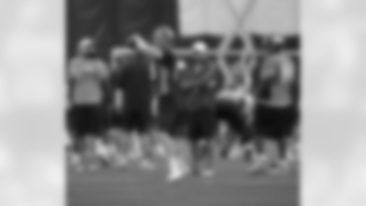 QB Peyton Manning delivers a pass during practice.
