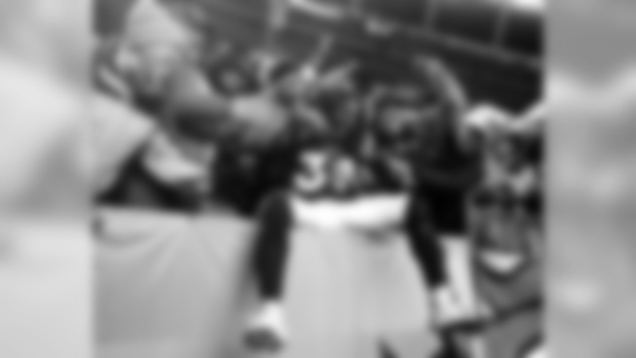 David Bruton jumps into the stands after the win against the Pittsburgh Steelers in the AFC Wild Card playoff game January 8, 2012 at Sports Authority Field at Mile High.