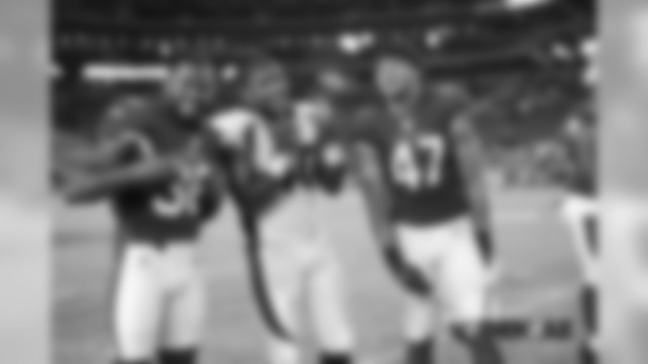 Keishawn Bierria poses for a photo with Cardinals safety Buddha Baker (36) and Ezekiel Turner (47) after the Broncos' preseason game against the Arizona Cardinals on August 30, 2018.