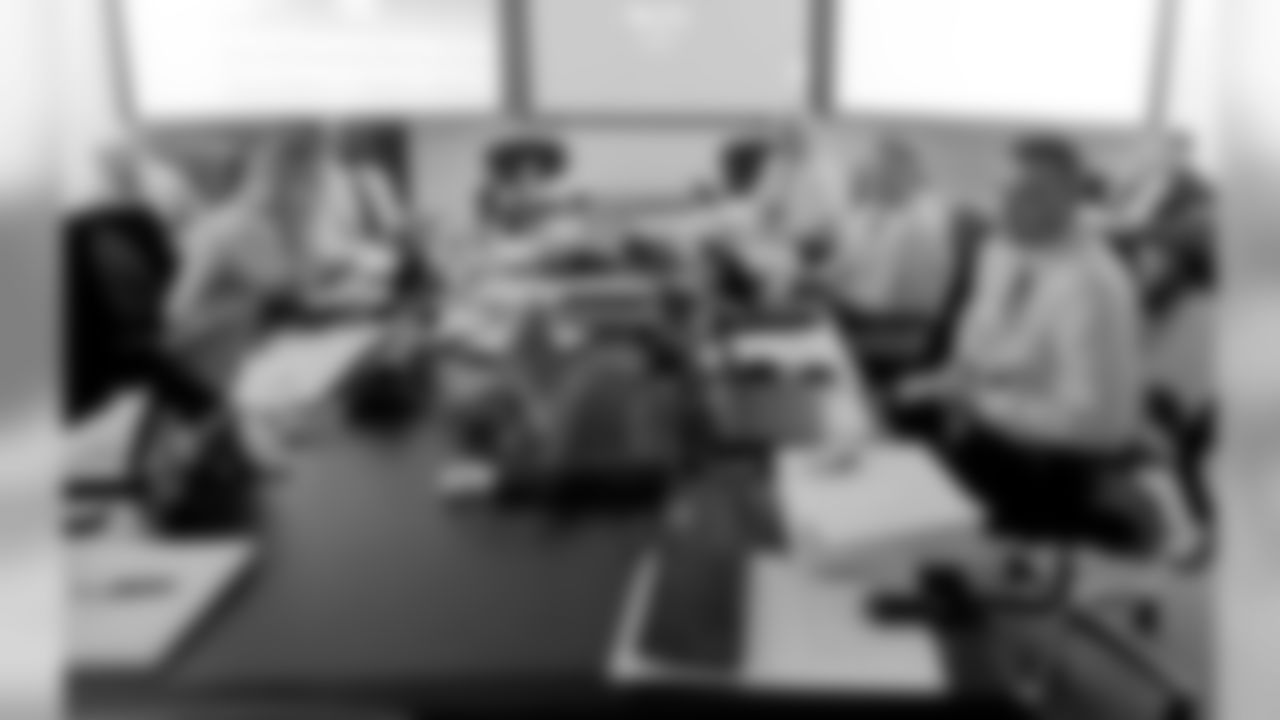 The Broncos front office in the team's draft room.