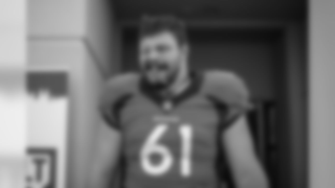Graham Glasgow walks out onto the field before the fourth training camp practice at UCHealth Training Center on August 16, 2020. (Photo by Ben Swanson)