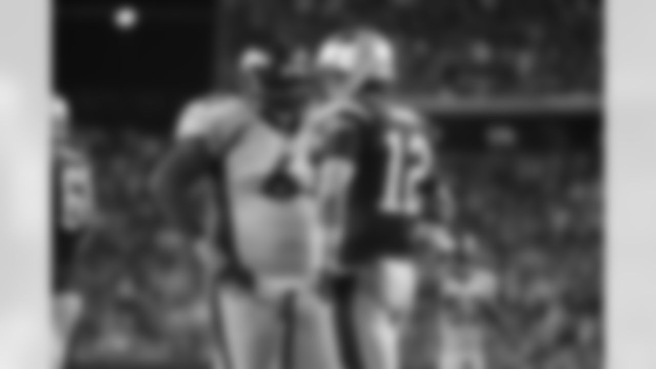 Gerard Warren goes face to face with Tom Brady during the Broncos' 17-7 win over the Patriots at Gillette Stadium in Foxborough, Massachusetts, on Sept. 24, 2006.