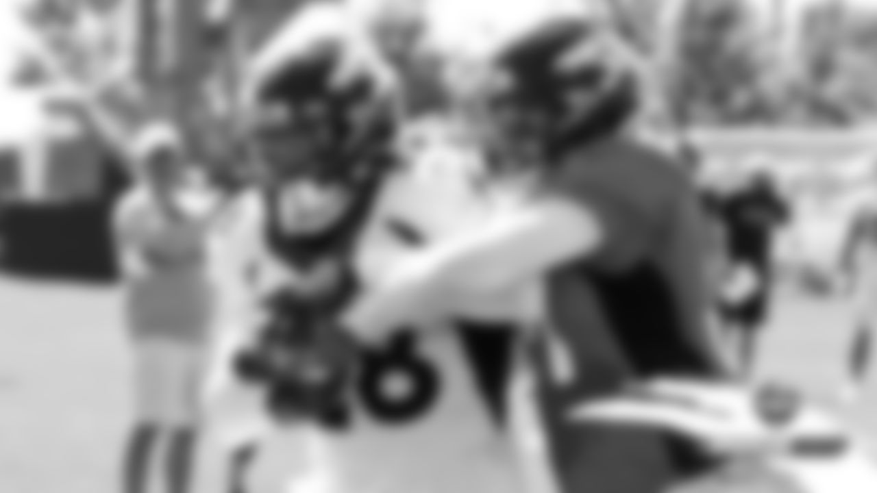 Royce Freeman and Justin Simmons during practice on Day 12 of training camp on August 4, 2019.