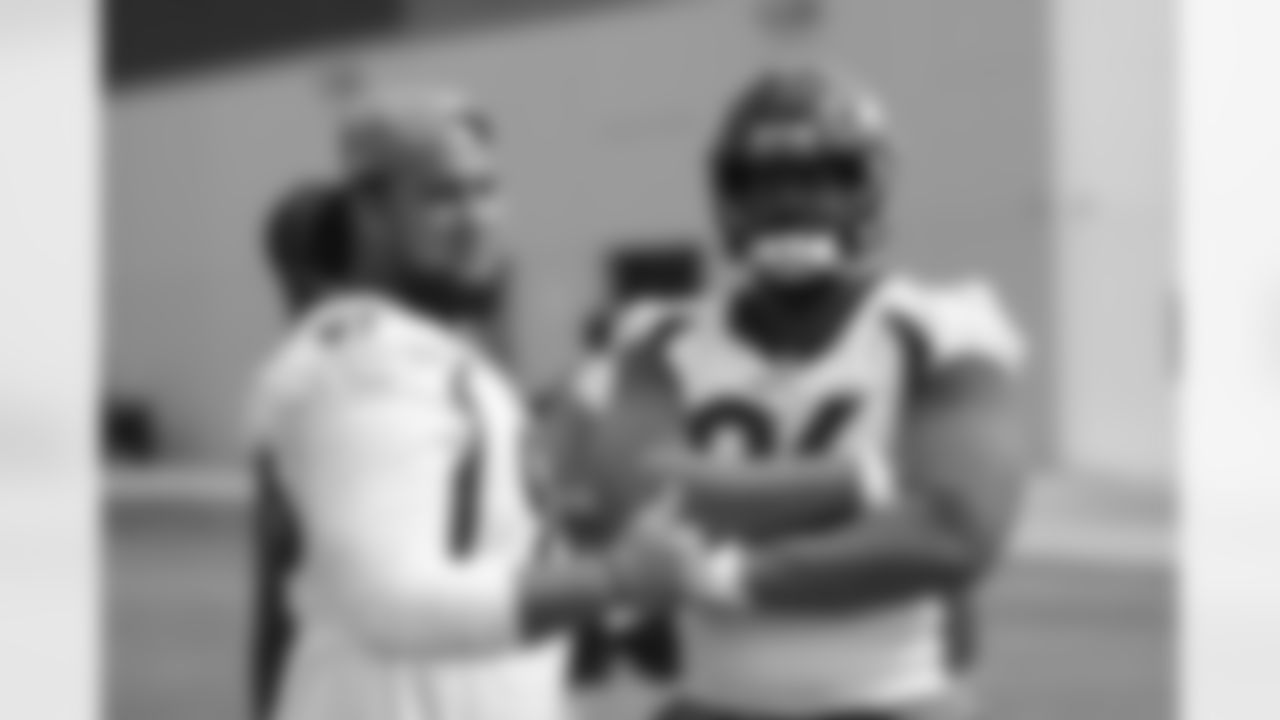 Mike Purcell and Shelby Harris pose for a photo during the ninth training camp practice at UCHealth Training Center on August 24, 2020. (Photo by Ben Swanson)