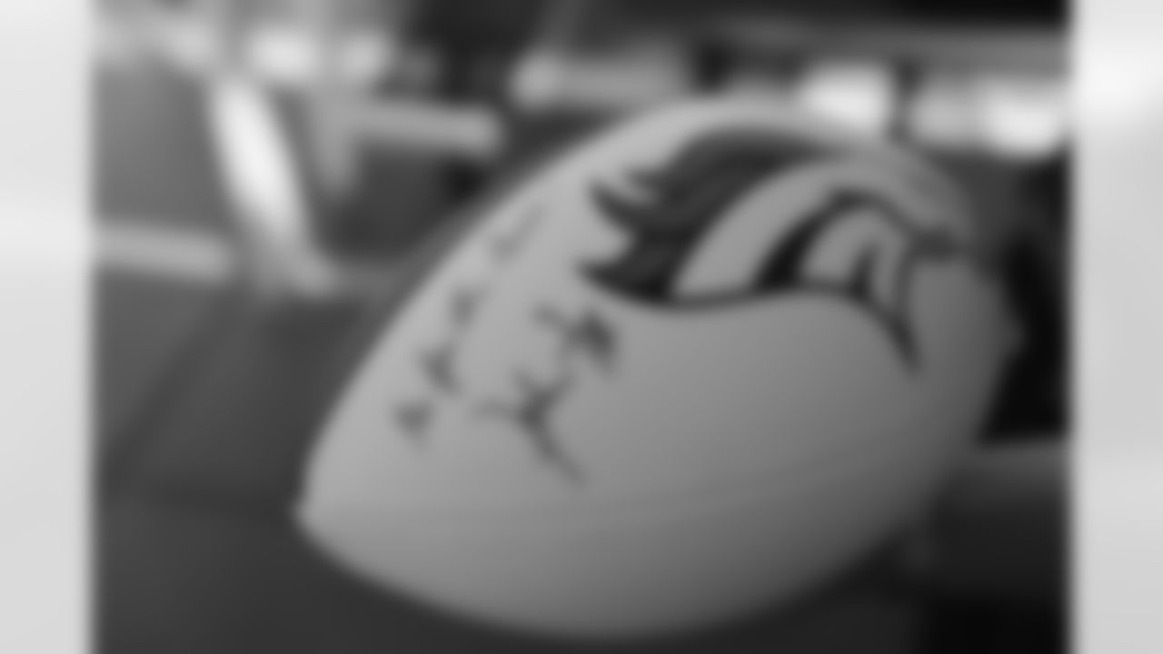 Head Coach John Fox signed a football for Franklin. "Go for the gold!"