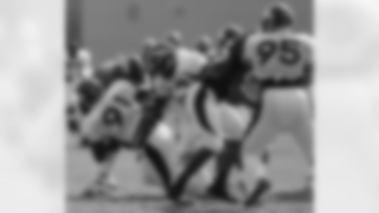 DE Robert Ayers breaks into the backfield to make a tackle.