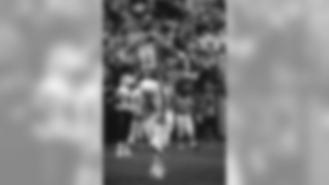 Running backs Gene Lang and Sammy Winder celebrate during a September 15, 1985 win (34-23) over the New Orleans Saints at Mile High Stadium.