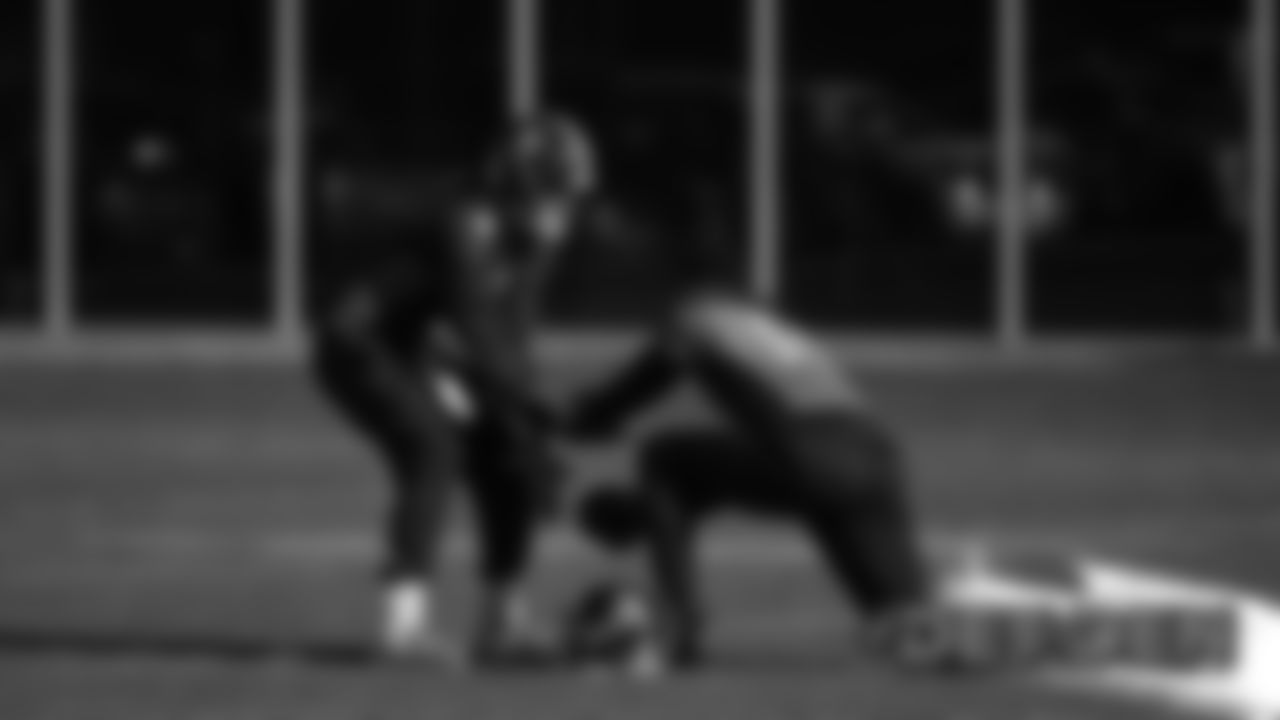 Drew Lock takes a snap from Courtland Sutton during practice on December 20, 2019 at UCHealth Training Center. (Photo by Ben Swanson)