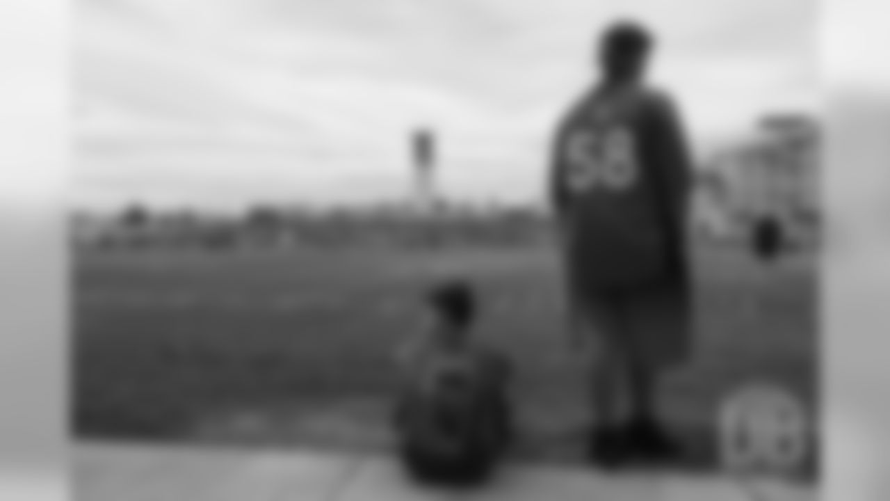 TJ, a 12-year-old fighting cystic fibrosis, wanted to be Von Miller for a day, and the Make-A-Wish Foundation helped make that dream come true on September 29, 2018. Here, he and his brother watch practice.