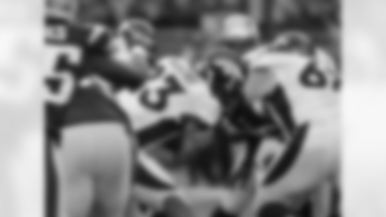RB Willis McGahee fights through the line during the first half against the New England Patriots.