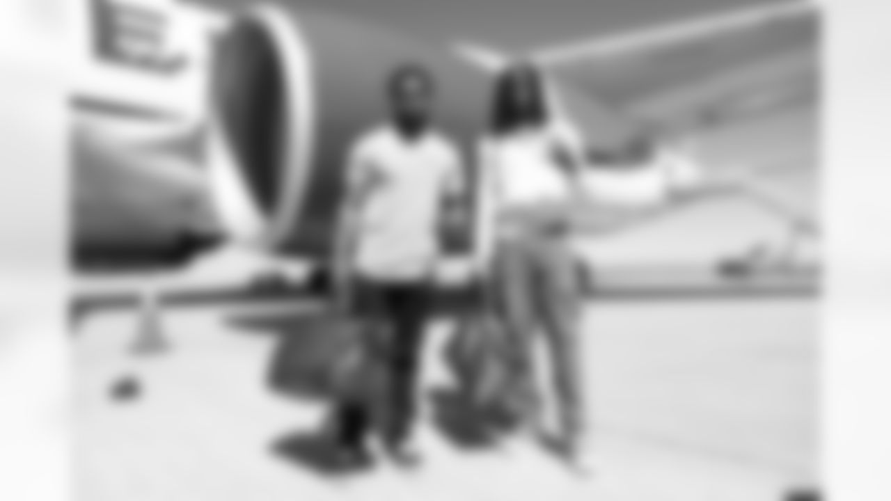 Montrell Washington and Jerry Jeudy on the tarmac at Denver International Airport on September 11, 2022 during the team's travel to Seattle for a Week 1 game against the Seahawks. (Photo by Ben Swanson)