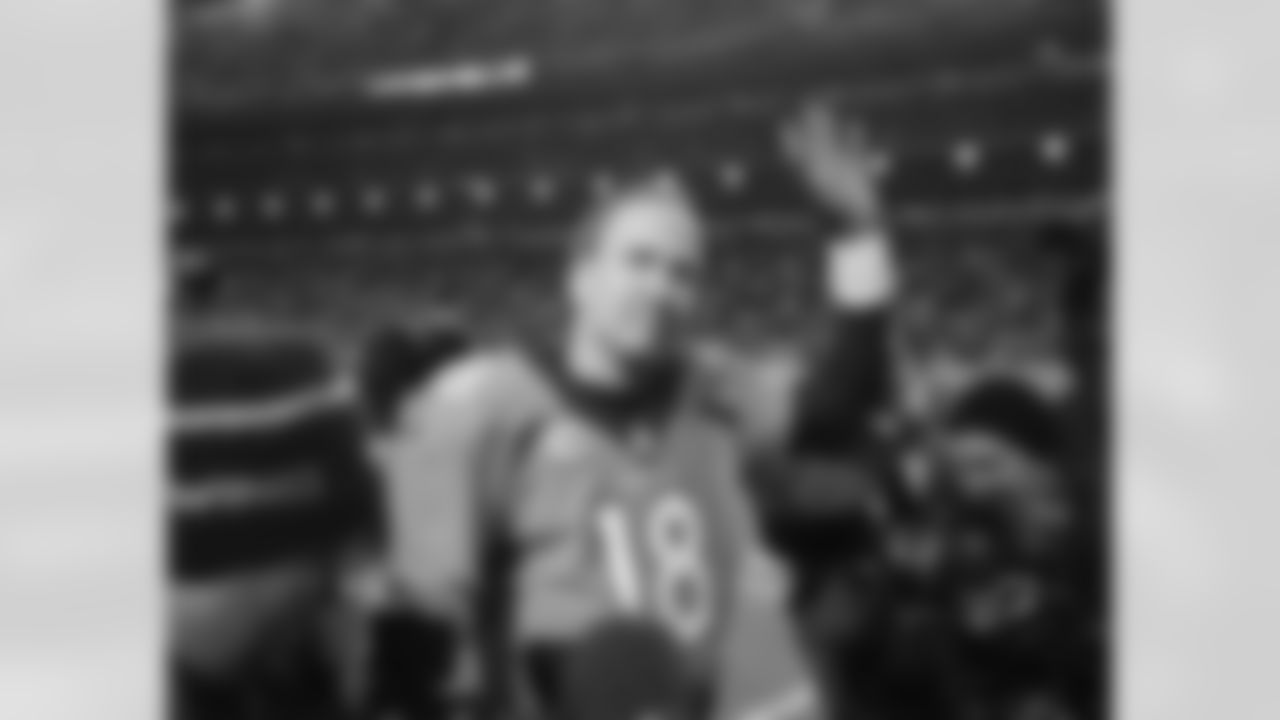 Denver Broncos quarterback Peyton Manning (18) waves to fans after action against the Pittsburgh Steelers in the AFC Divisional Playoff NFL game at Sports Authority Field in Denver, CO, January 17, 2015. Photo by Ben Hays.