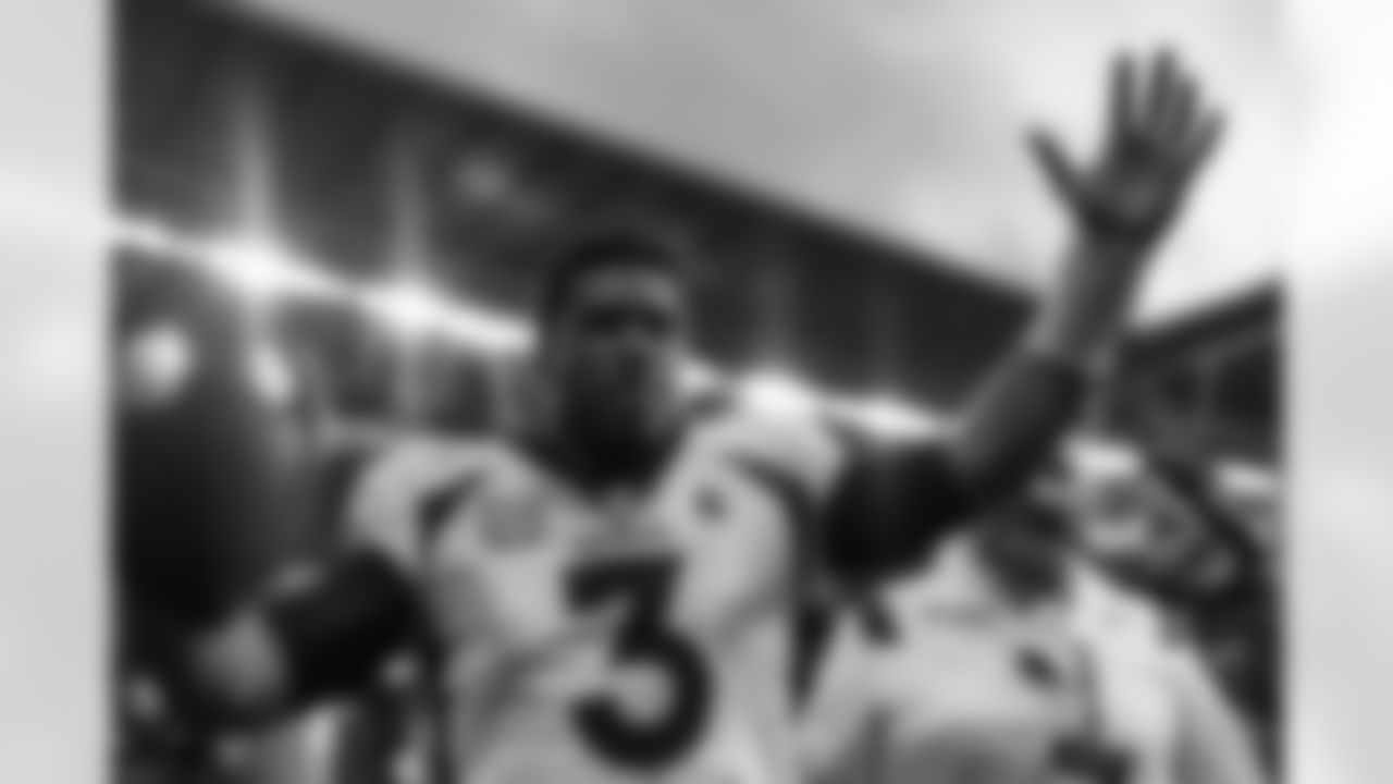 Russell Wilson pumps up the crowd in celebration after during the Broncos' Week 8 game against the Jacksonville Jaguars at Wembley Stadium in London, England in the United Kingdom on October 30, 2022. (Photo by Ben Swanson)