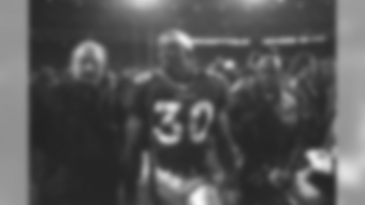 Terrell Davis exits the field after the Broncos' victory over the Jets in the AFC Championship at Mile High Stadium in Denver, CO on January 17, 1999.
