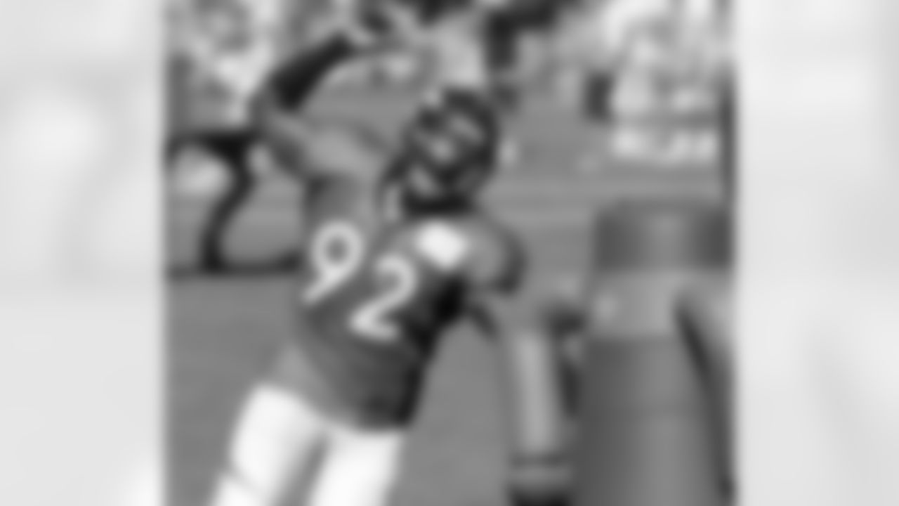 DE Elvis Dumervil gets ready to attack the tackling dummy.
