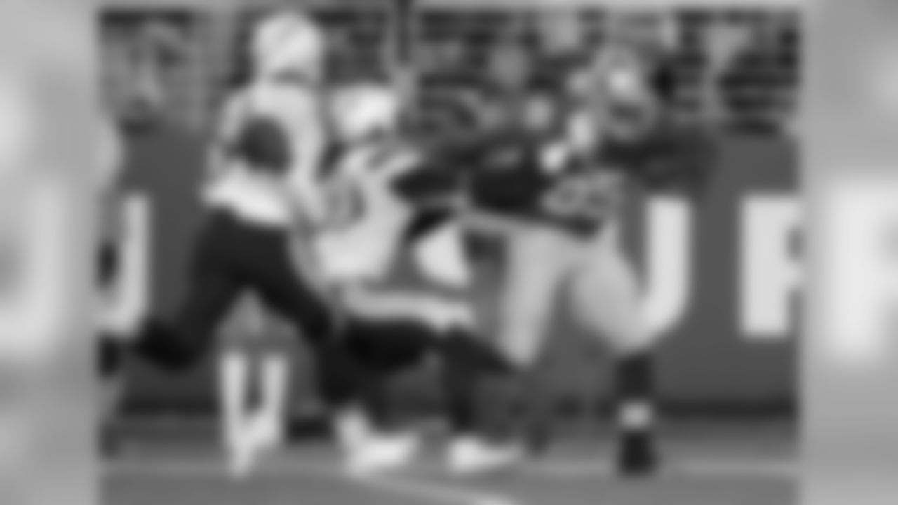 49ers tight end Vernon Davis tries to power through a tackle attempt by Jahleel Addae. San Francisco will visit the Broncos for Denver's home opener in the 2015 preseason.