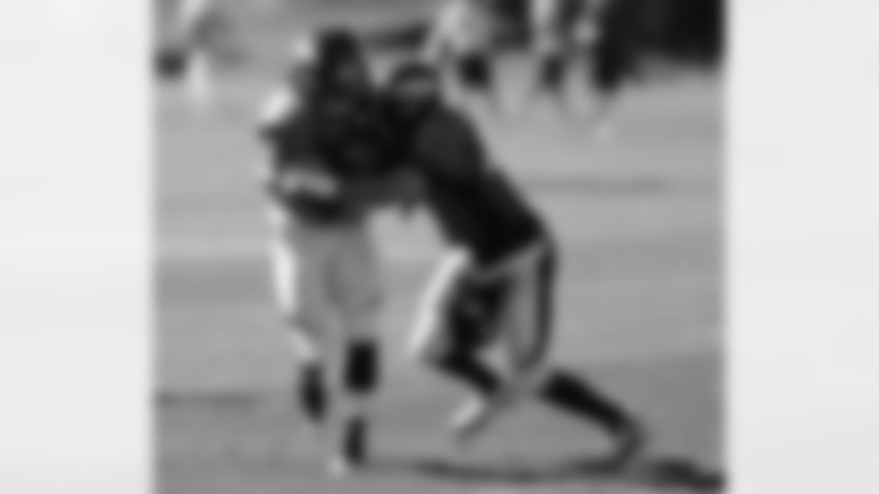 LB Mike Mohamed hits LB Danny Trevathan.