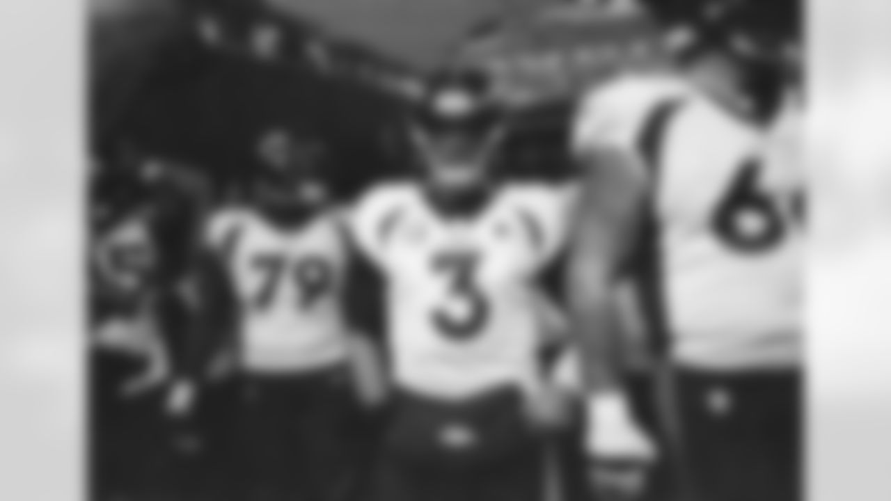 Russell Wilson in the tunnel with teammates during the Broncos' Week 8 game against the Jaguars at Wembley Stadium in London on October 30, 2022. This image is part of the Broncos' film series documenting the team's trip to London. (Photo by Ben Swanson)
