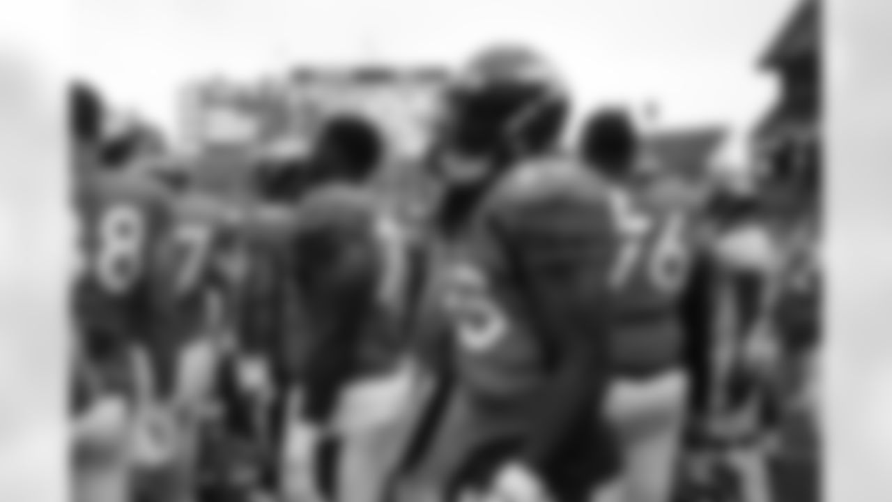 Melvin Gordon III in the team huddle during practice on Day 12 of training camp at Empower Field at Mile High on August 29, 2020. (Photo by Ben Swanson)