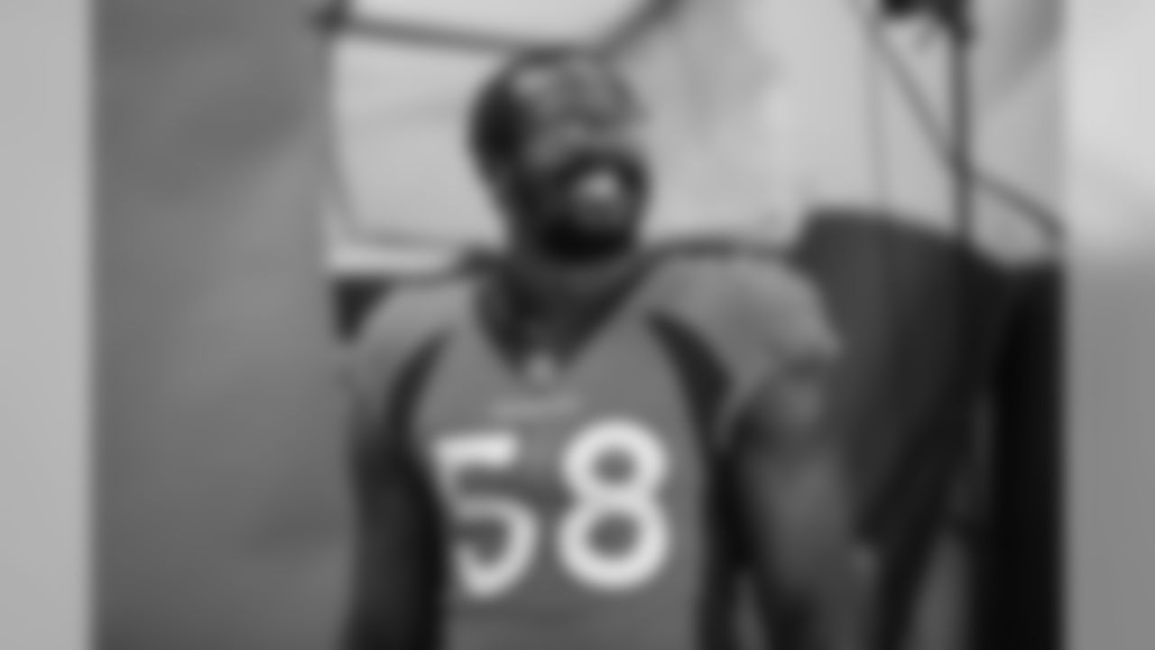 Von Miller smiles during the team's annual media day photoshoots on August 2, 2020. (Photo by Ben Swanson)