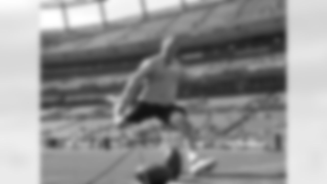 K Matt Prater kicks one through the uprights while warming up for his team's division opener.