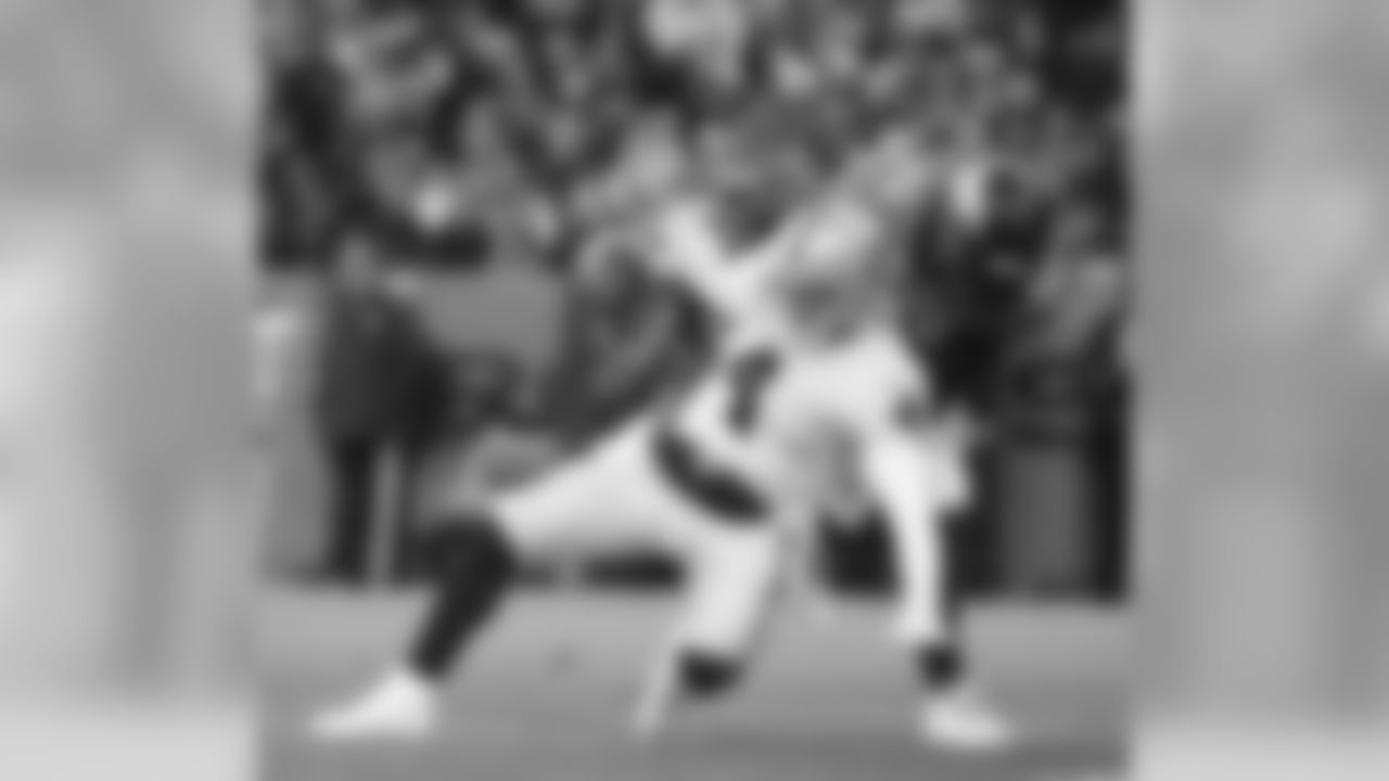 Denver Broncos defensive end DeMarcus Ware (94) tackles Oakland Raiders quarterback Derek Carr (4) after he fumbled the ball during second quarter action against the Oakland Raiders during the game at Sports Authority Field at Mile High in Denver, CO, December 28, 2014.
Photo by Gabriel Christus