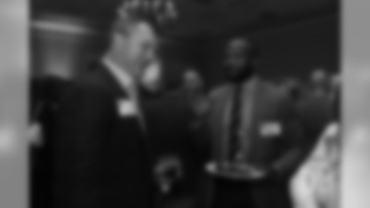 John Lynch greets Champ Bailey at the Pro Football Hall of Fame's Celebration of Excellence Reception in Atlanta on January 31, 2019.