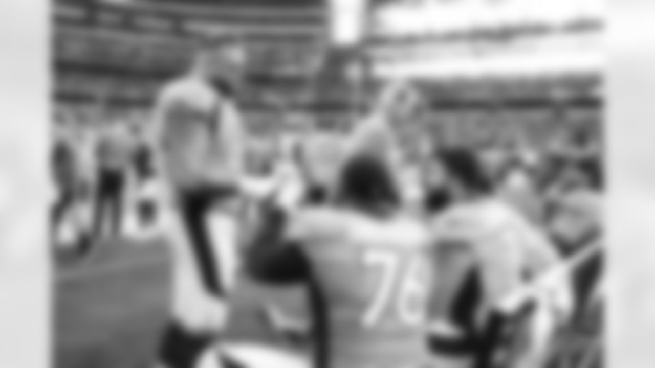 Denver Broncos guard Dalton Risner (66) and offensive tackle Calvin Anderson (76) celebrate on the bench during the NFL game against the Dallas Cowboys on Sunday, November 7, 2021 at AT&T Stadium in Arlington, Texas.
Photo by Gabriel Christus