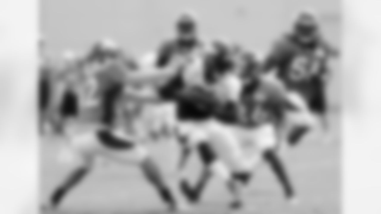 Hillman runs with the ball after a catch.