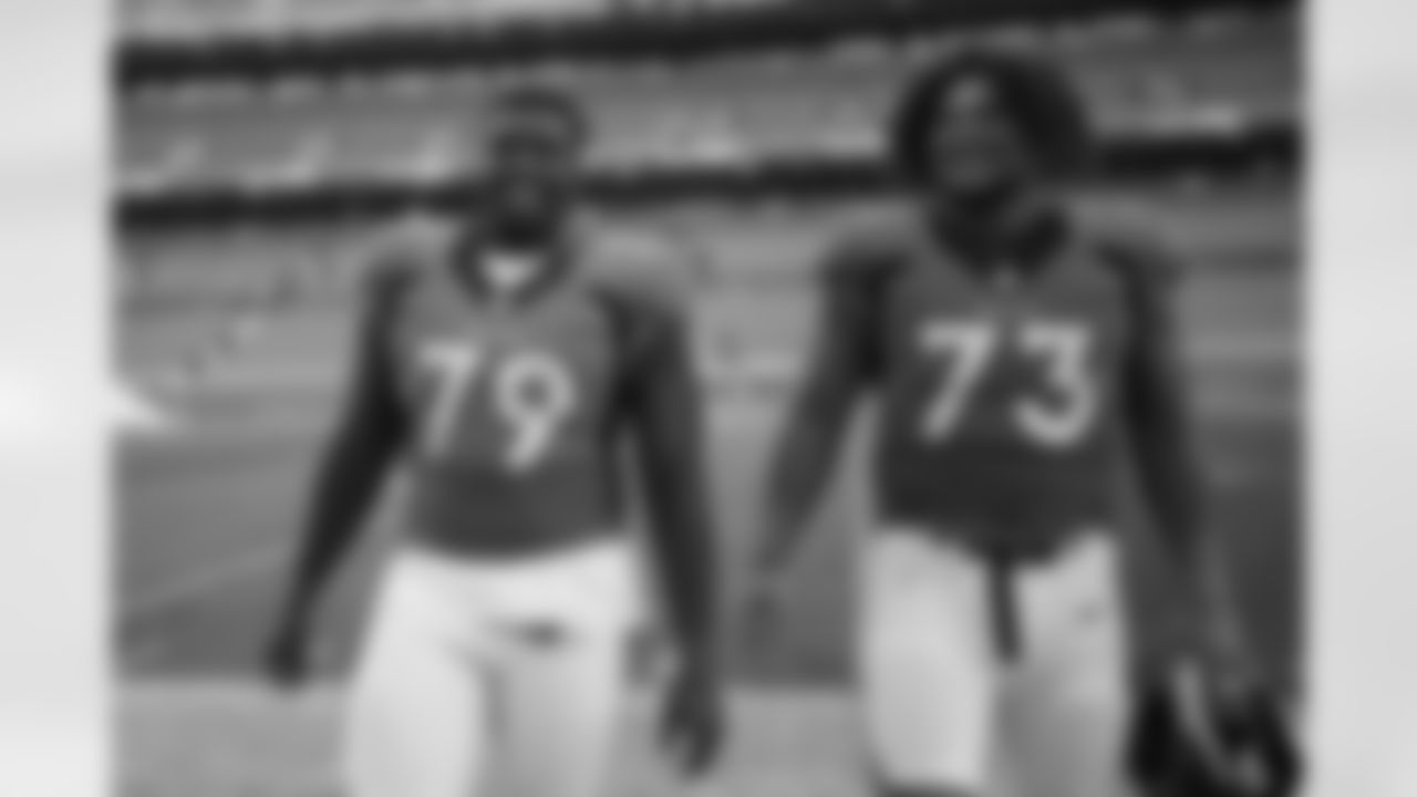Lloyd Cushenberry III and Netane Muti after practice on Day 12 of training camp at Empower Field at Mile High on August 29, 2020. (Photo by Ben Swanson)
