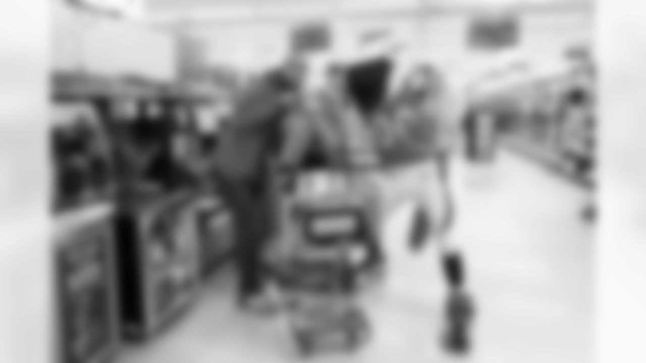 With help from Miles the mascot and Denver Broncos Cheerleaders, the Broncos gave away a total of $10,000 in groceries to Broncos fans at a King Soopers in Federal Heights, Colorado on January 3, 2021. (Photo by Ben Swanson)