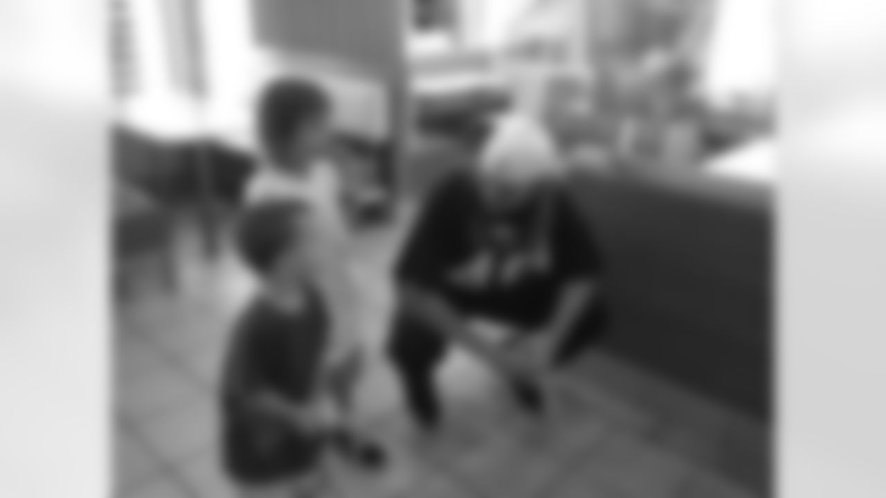 Broncos long snapper Aaron Brewer visits with some young Broncos fans at a local McDonald's.