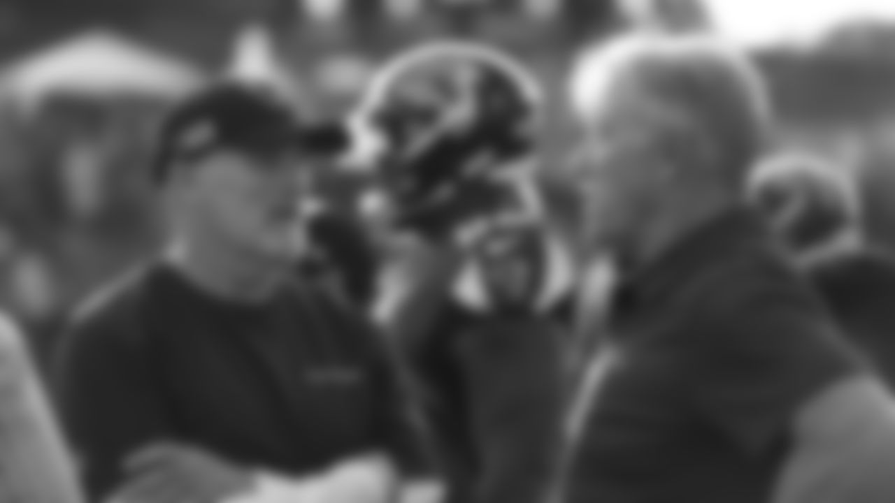 Falcons head coach Dan Quinn talks with President of Football Operations/General Manager John Elway before the Broncos' preseason matchup with the Falcons in the Pro Football Hall of Fame Game on August 1, 2019 at Tom Benson Hall of Fame Stadium.