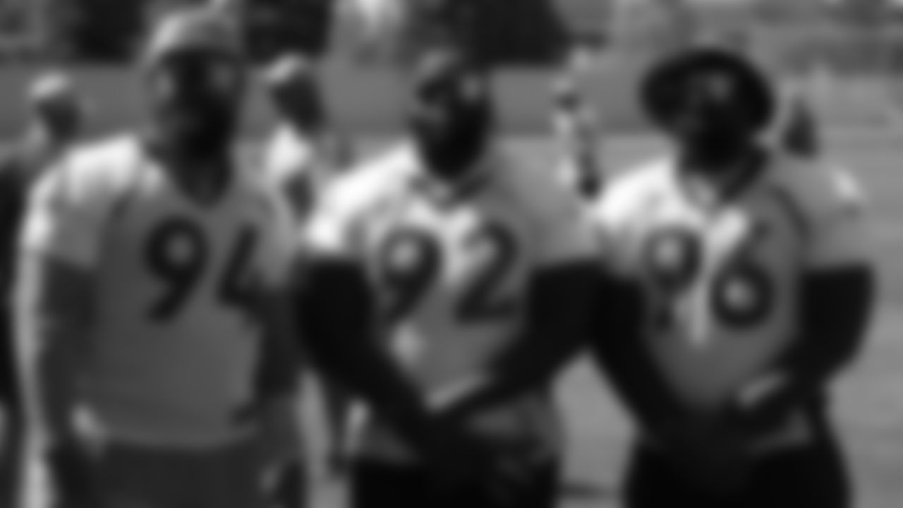 (from left to right) Domata Peko Sr., Zach Kerr and Shelby Harris pose before practice on Sept. 8, 2018.