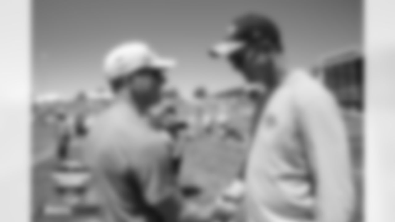 Peyton Manning talks with General Manager George Paton at practice on Day 4 of training camp at UCHealth Training Center in Englewood, Colorado on July 30, 2022. (Photo by Ben Swanson)