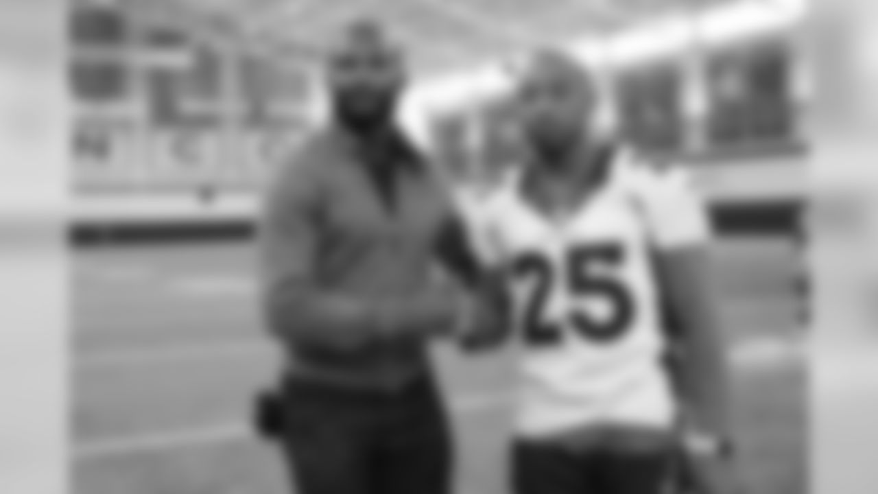 Pro Football Hall of Fame and Broncos Ring of Fame cornerback Champ Bailey talks with Chris Harris Jr. at practice on October 11, 2019 at UCHealth Training Center. (Photo by Ben Swanson)