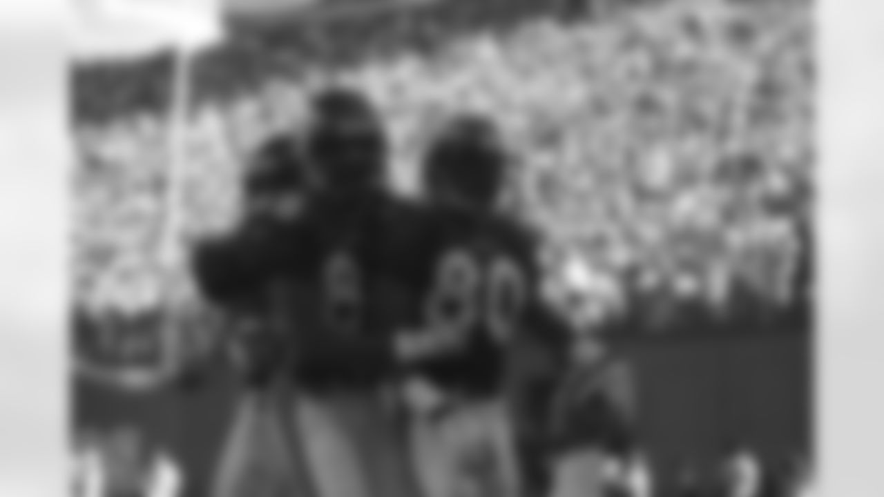 Denver: Rod Smith and Willie Green celebrate a touchdown catch against the St. Louis Rams at Mile High Stadium in Denver, CO on September 14, 1997.