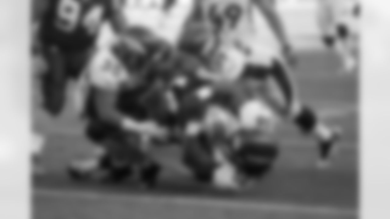A slew of Denver defenders make a special-teams tackle.