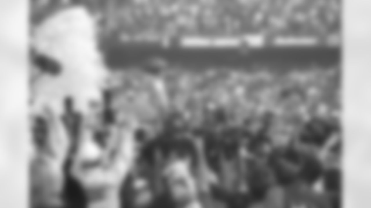 John Elway basks in the moment after the Broncos beat the Green Bay Packers in Super Bowl XXXII — his first Super Bowl win after the team fell in his first three.