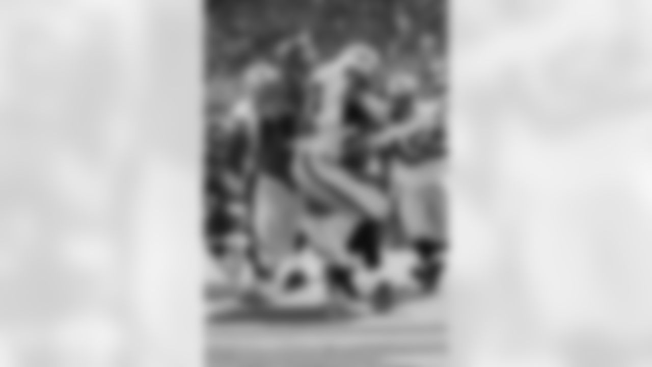 DE Derek Wolfe wraps up Oakland RB Darren McFadden.