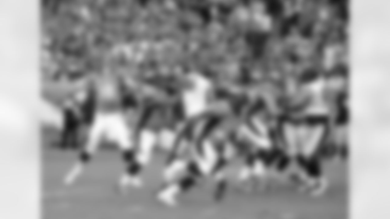 Manning throws a pass.