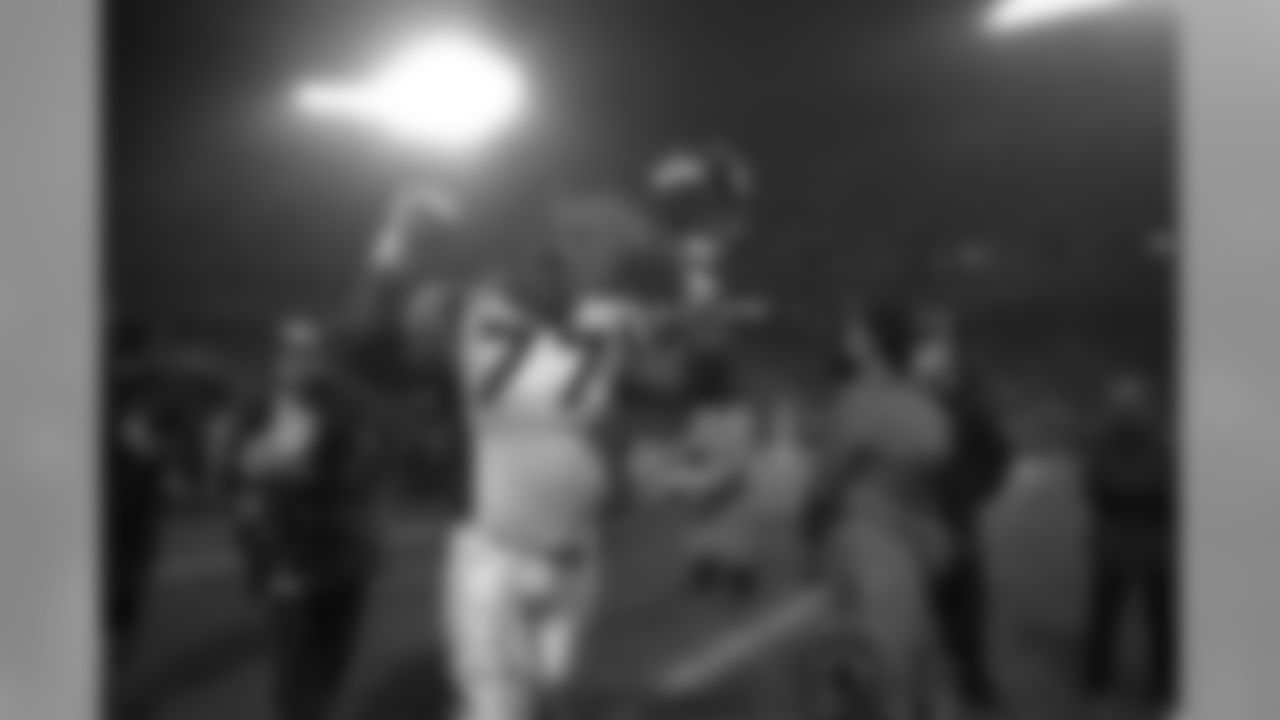 Tony Jones walks triumphantly off the Arrowhead Stadium Field after the Broncos win their second round playoff game against the Kansas City Chiefs at Arrowhead Stadium in Kansas City on January 4, 1998.