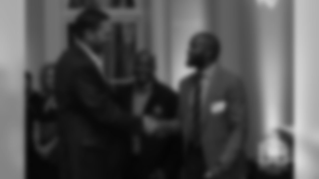 Hall of Fame finalists Champ Bailey and Tony Boselli shake hands at the Pro Football Hall of Fame's Celebration of Excellence Reception in Atlanta on January 31, 2019.