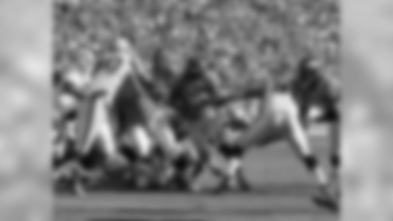 RB Willis McGahee charges through a hole and into the end zone after the good field position from the deflected punt.