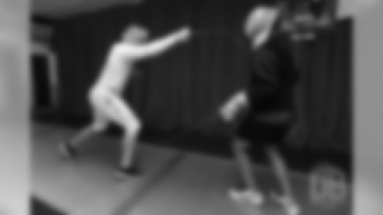 Brandon McManus and Casey Kreiter try their hands at fencing at the Denver Fencing Center on July 17, 2018.