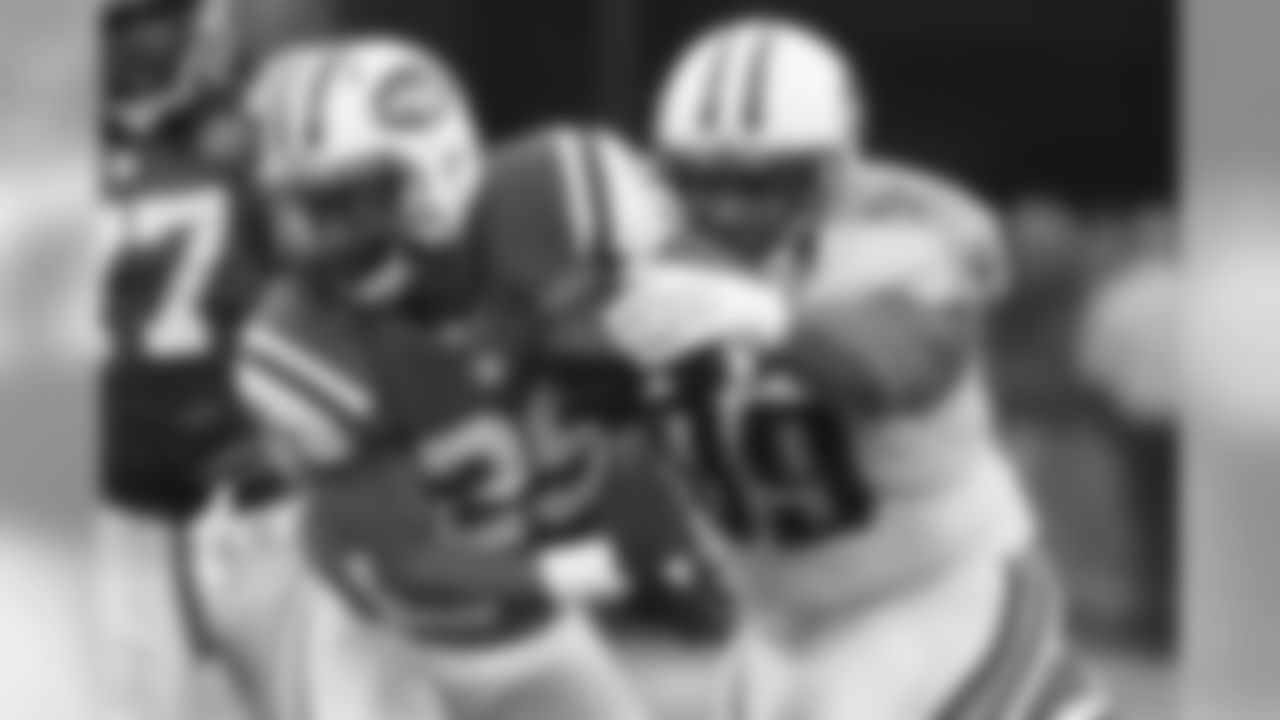 Tennessee Titans defensive end Jurrell Casey (99) tackles New York Jets' Bilal Powell (29) during the second half of an NFL football game Sunday, Dec. 13, 2015, in East Rutherford, N.J. (AP Photo/Julio Cortez)