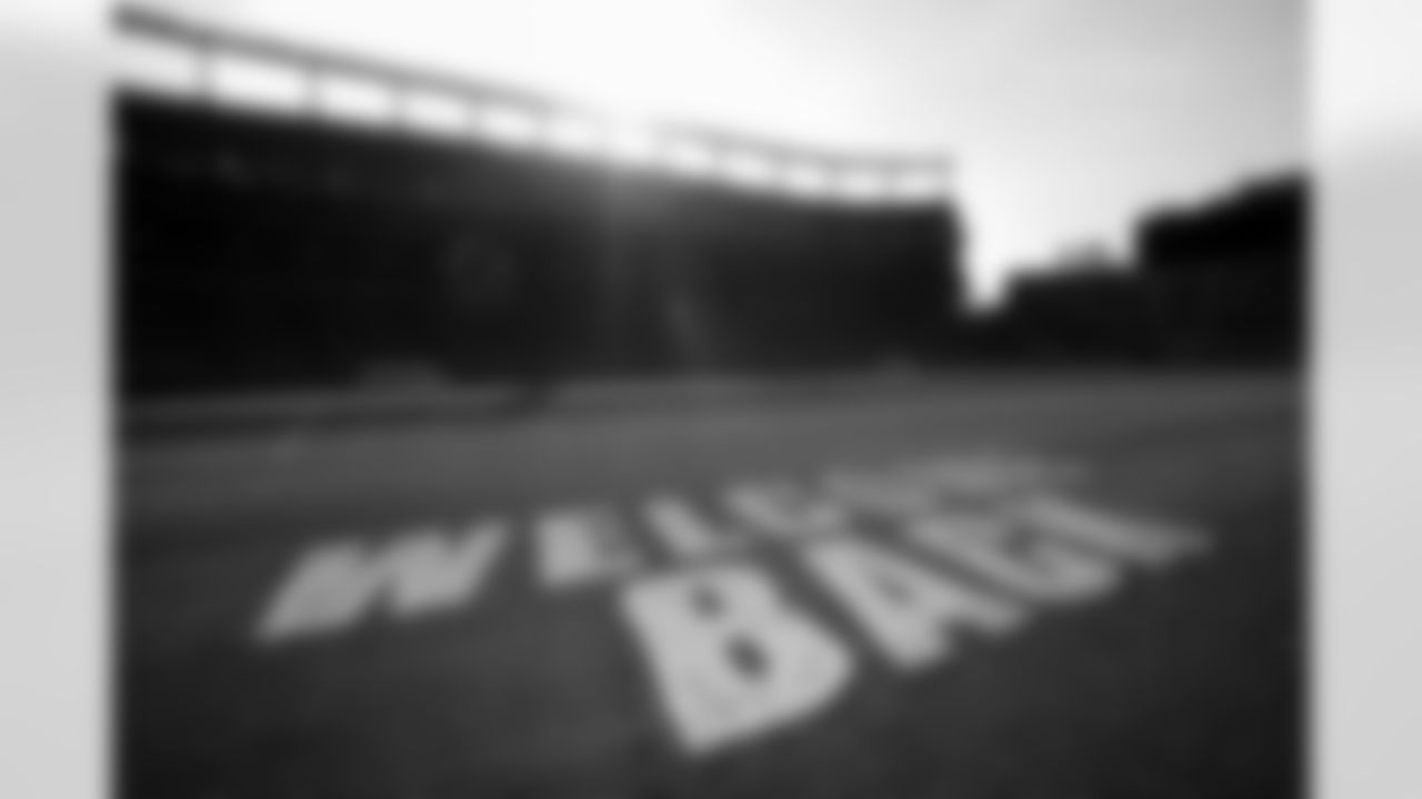 Members of the stadium's turf crew paint the field at Empower Field at Mile High on September 23, 2021 ahead of the team's Week 3 home opener. (Photo by Ben Swanson)